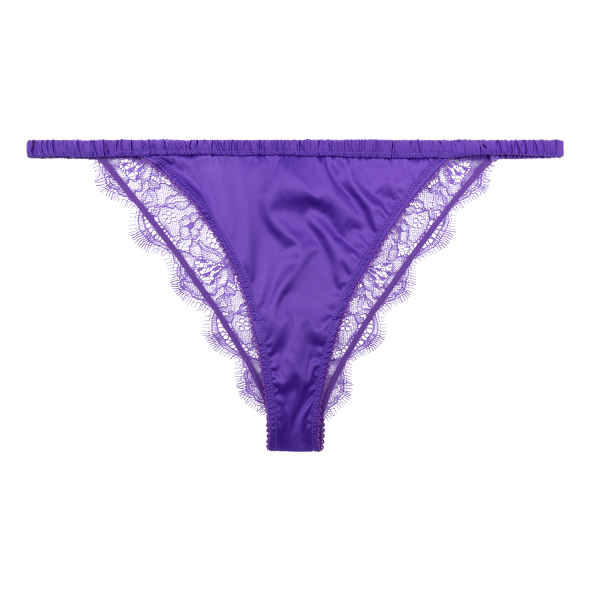 Premium Photo  Light yellow women's panties on an orange and purple  background women's underwear flat lay